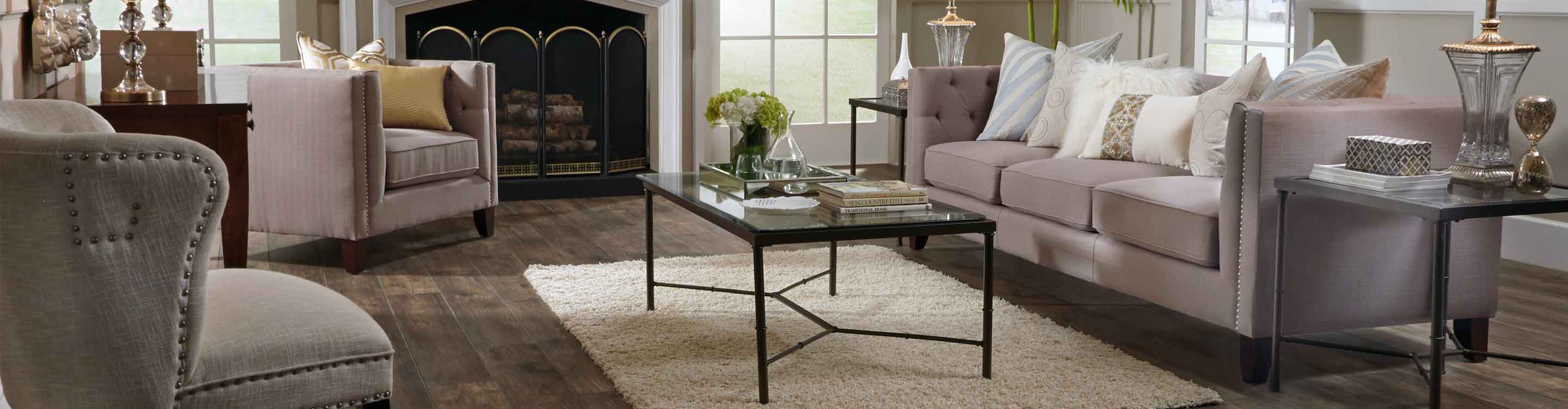Darker wood look laminate floor living room with cream rug 
