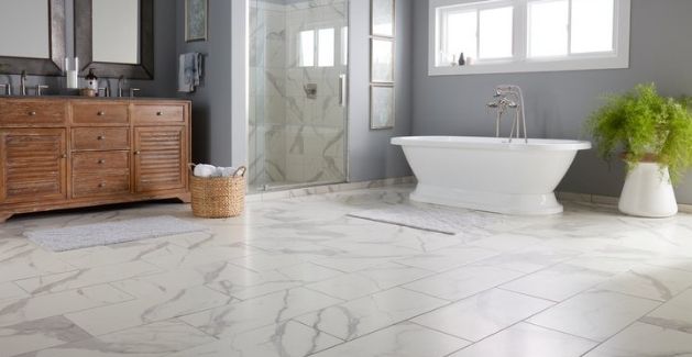 a large bathroom with marble tile